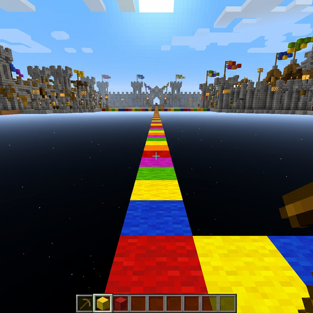 First-person view of Godbridging in Minecraft - colorful block bridge over the void